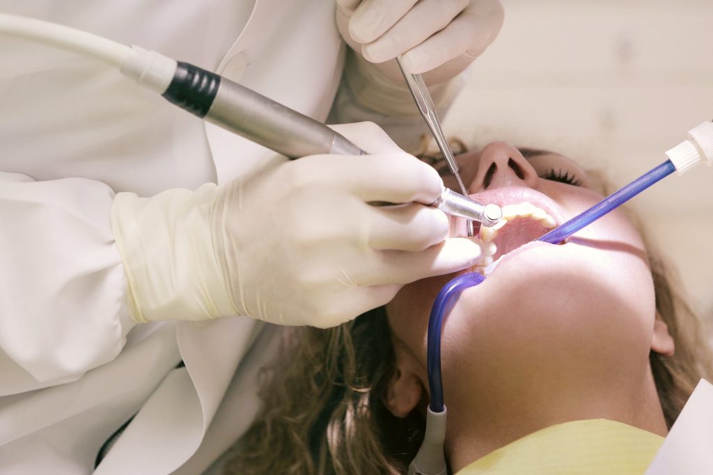 A dentist working on a patient.